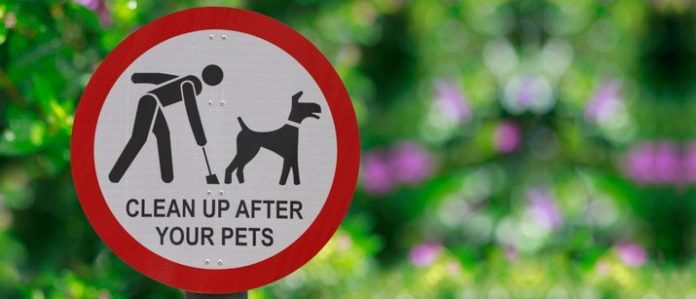 Sign 'Pick up after your pets'